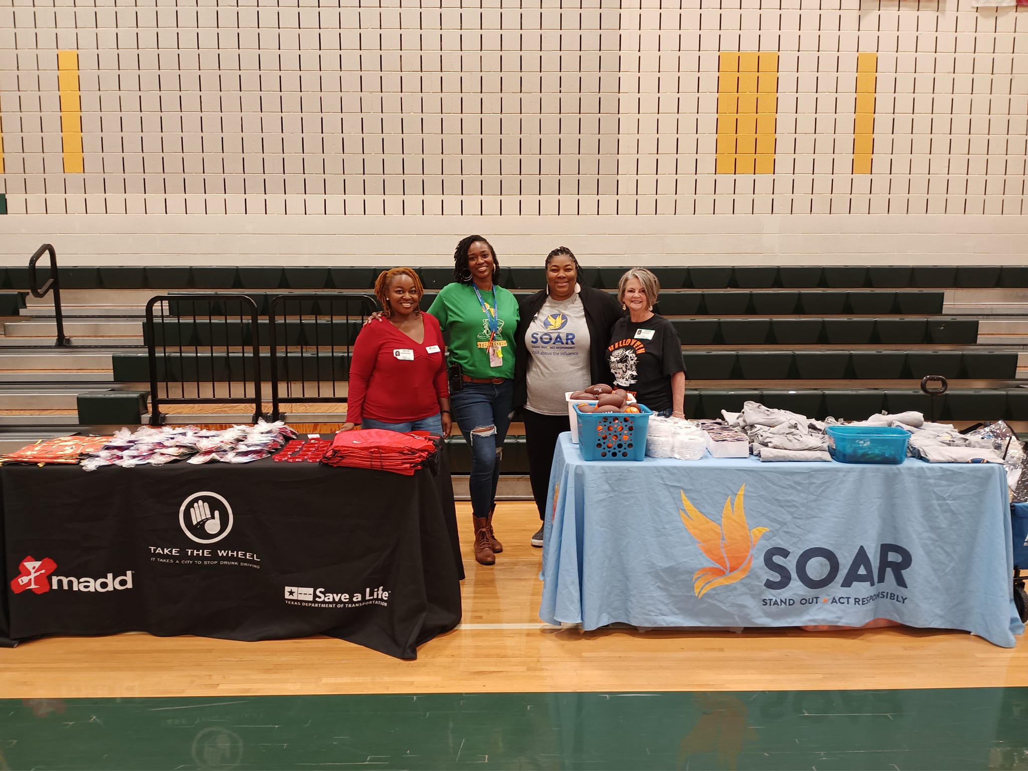 SOAR and MADD tables at basketball game.