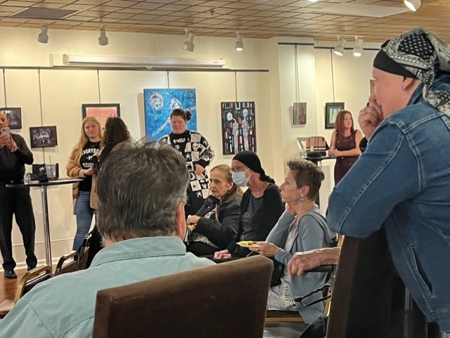 Attendees at the photo voice project and art exhibit.