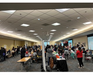 Attendees participating at community event, Telemundo